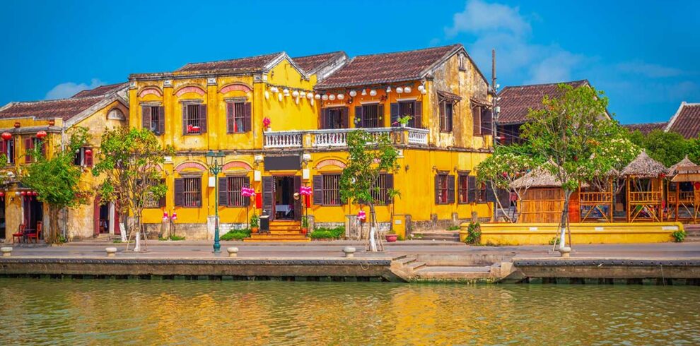 Hoi An Ancient Town – Local Vietnam tours | colorful yellow merchant houses along the Thu Bon River in Hoi An