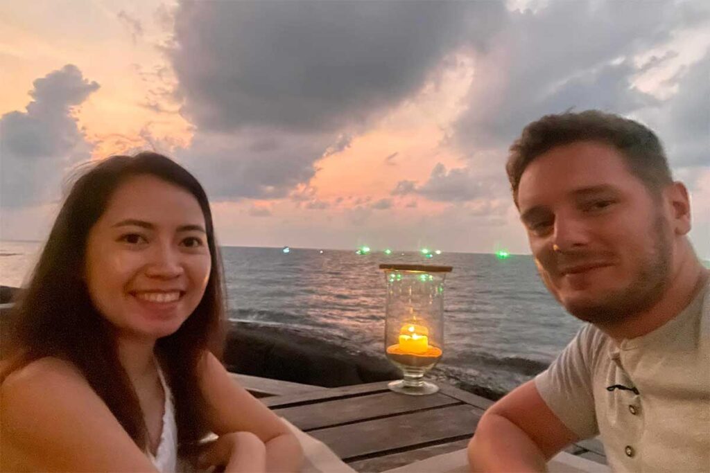 Marnick Schoonderwoerd and Nhung Phung from Local Vietnam dining by the sea during sunset in Phu Quoc, Vietnam