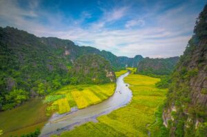 Ninh Binh Vietnam – Local Vietnam tours | aerial view of Tam Coc river winding through rice fields and karst mountains