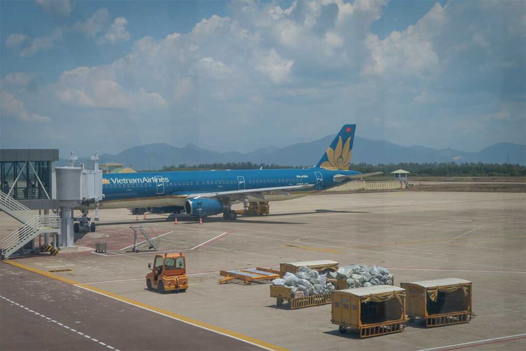 Vietnam Airlines aircraft at Quy Nhon Airport (Phu Cat), highlighting direct flight connections to Hanoi and Ho Chi Minh City.
