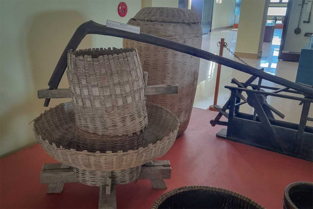 Collection of woven baskets and farming tools displayed at Phu Yen Museum, representing traditional agricultural life in the province.