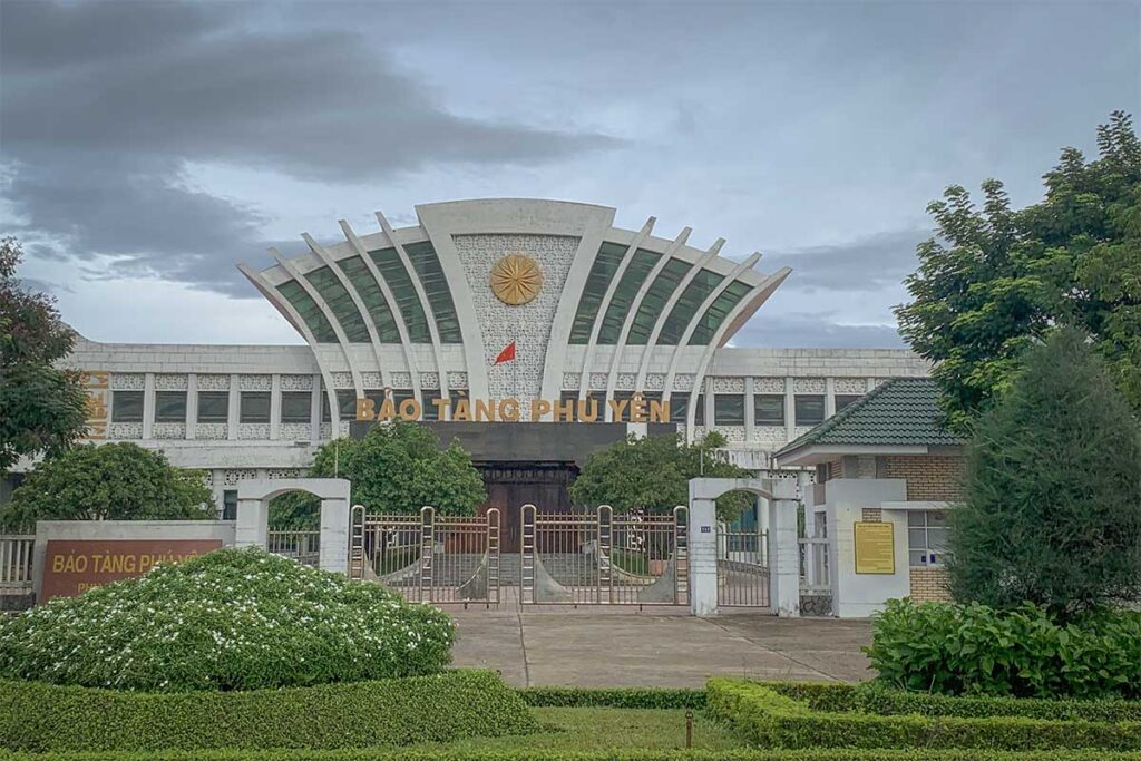 Image of Phu Yen Museum’s main entrance with its symbolic design, inspired by the Hung King’s hat and decorated with bronze drum motifs.