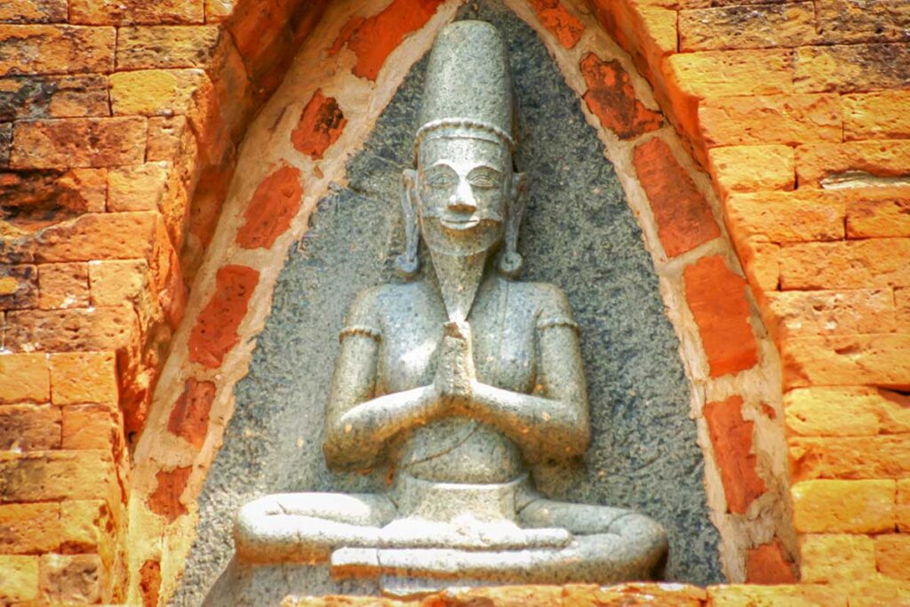 Close-up of a stone Shiva carving at Po Klong Garai Tower in Phan Rang, a symbol of Cham Hindu culture and spiritual devotion.