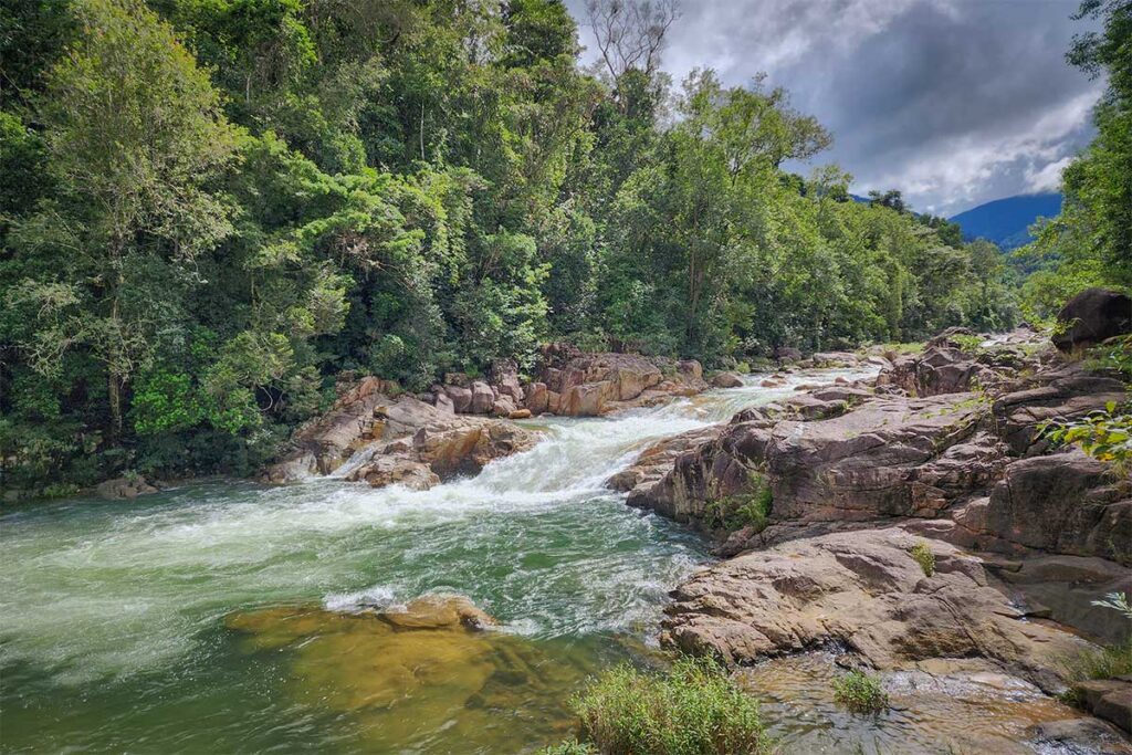 Clear waters of Suoi Dau Waterfall flowing through rocky pools in Hon Ba Nature Reserve – a refreshing stop halfway up the mountain road from Nha Trang.