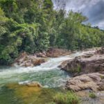 Clear waters of Suoi Dau Waterfall flowing through rocky pools in Hon Ba Nature Reserve – a refreshing stop halfway up the mountain road from Nha Trang.