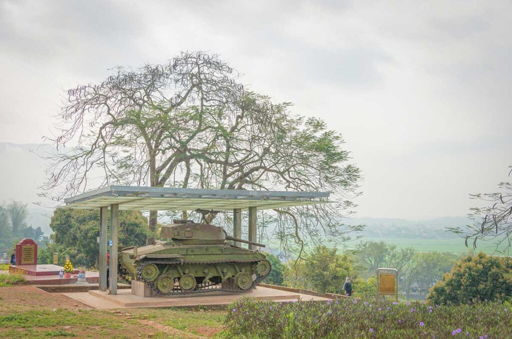 A1 Hill tours with the preserved French tank memorial overlooking the valley in Dien Bien Phu