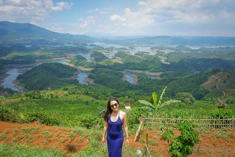 Nhung Phung overlooking the lakes and rolling hills of Vietnam’s Central Highlands — discovering remote nature destinations for Local Vietnam’s eco-travel projects.
