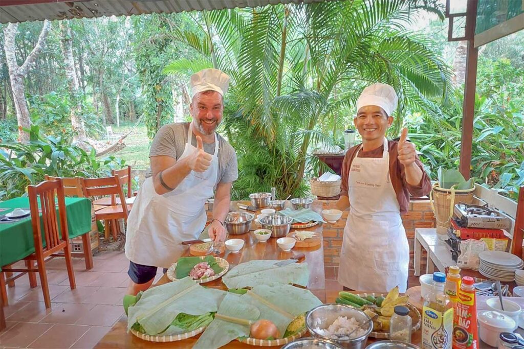 Cooking class at Phu Quoc Countryside Pepper Farm with a tourist and local chef preparing Vietnamese dishes together