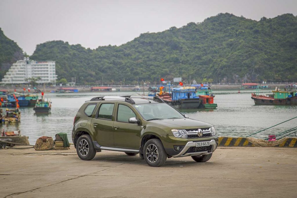 Modern SUV in Halong Bay harbor, used for private Hanoi to Halong Bay transfers — a popular Vietnam car rental route for travelers seeking flexible transport.