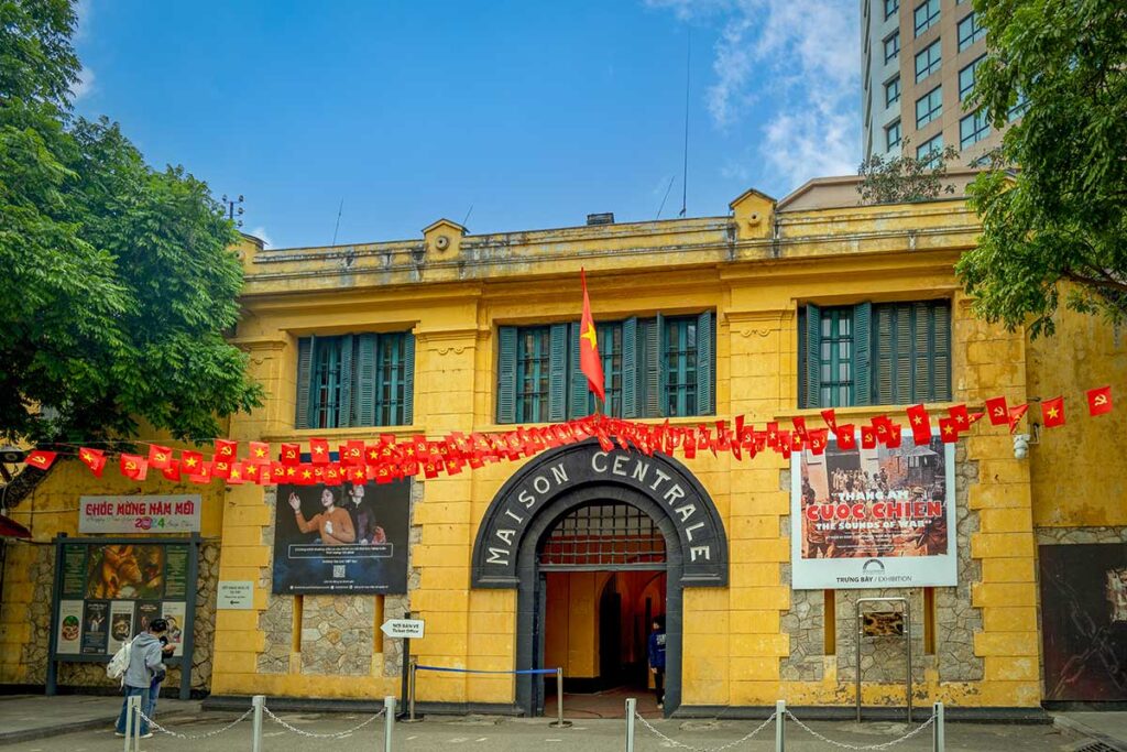 Hoa Lo Prison tours exploring the historic “Hanoi Hilton” with its yellow colonial facade and wartime exhibits