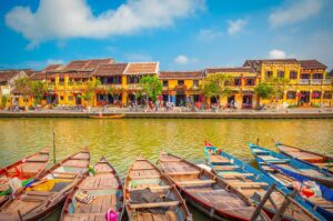 Colorful wooden boats along the riverside in Hoi An Ancient Town — a cultural gem often featured in Vietnam itineraries through central Vietnam.