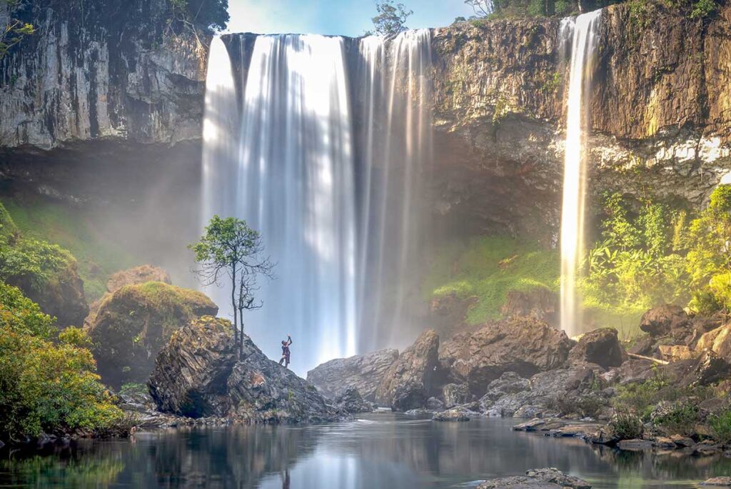 K50 Waterfall tours featuring the towering jungle waterfall and rocky pool in Kon Chu Rang