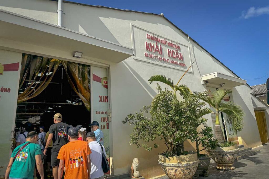 Group of tourists entering Khai Hoan fish sauce factory in Duong Dong Town, one of the most visited fish sauce factories in Phu Quoc