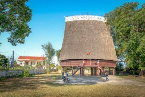 Kon Tum tours with a traditional Rong house standing tall in an ethnic village