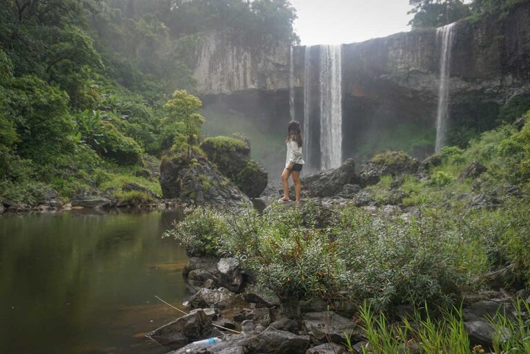 Nhung Phung visiting K50 Waterfall in Kon Chu Rang Nature Reserve — a hidden jungle destination she explored while developing Local Vietnam’s adventure itineraries.
