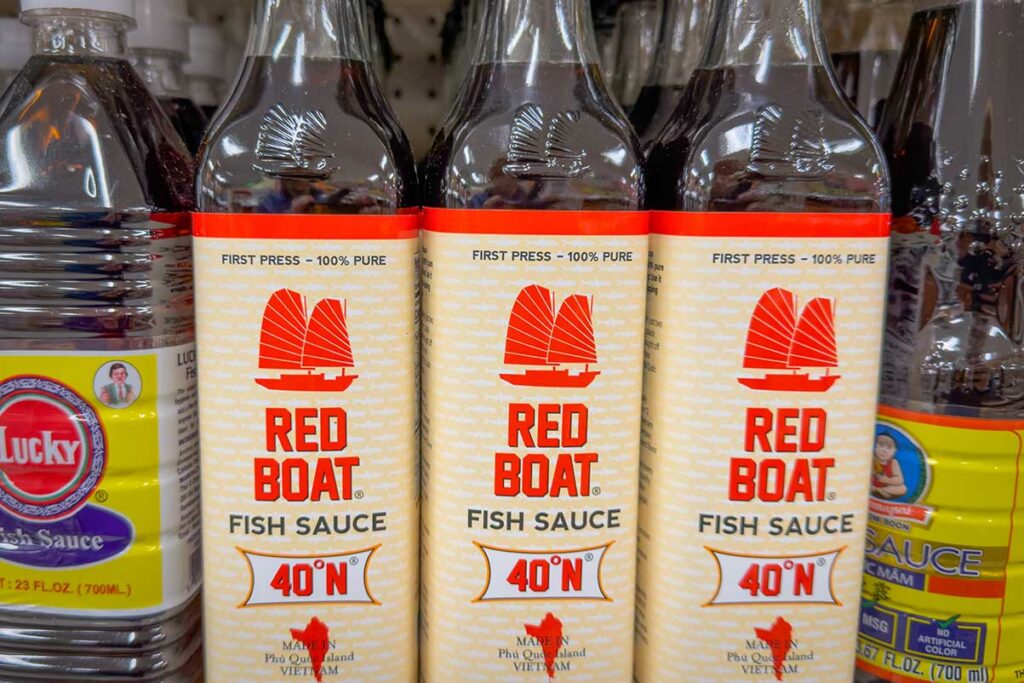 Bottles of Red Boat fish sauce made in Phu Quoc, Vietnam, sold on a store shelf in the United States