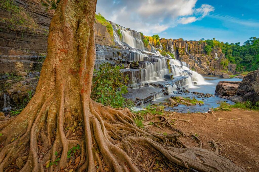 Majestic Pongour Waterfall near Dalat, a natural highlight featured in many central Vietnam package tours.