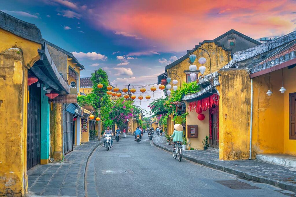 Lantern-lit streets and yellow merchant houses in Hoi An Ancient Town, a cultural highlight featured in many Vietnam package tours.