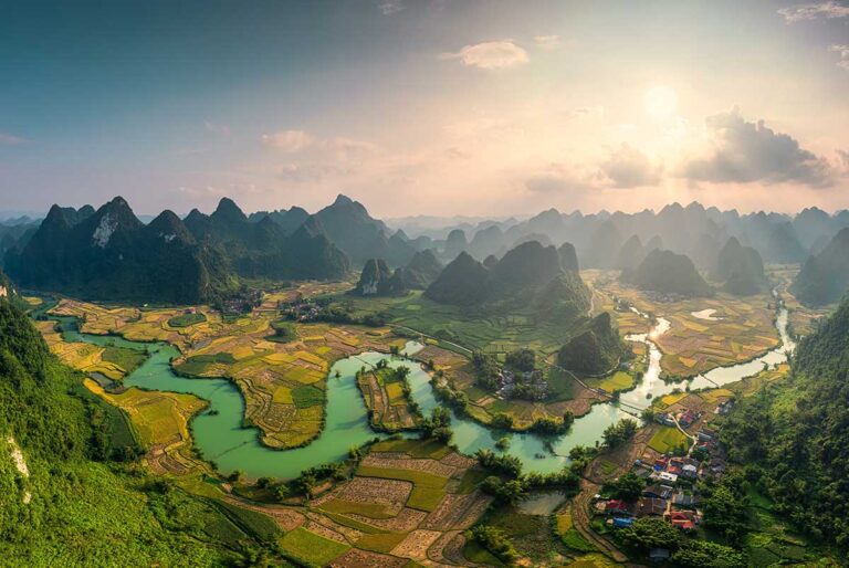 Aerial view of the karst mountains and rivers of Cao Bang, an untouched region explored on off-the-beaten-path Vietnam tours.