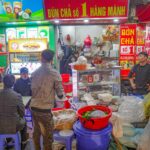 Hanoi food tours exploring local street food stalls in the Old Quarter with bun cha and traditional Vietnamese dishes