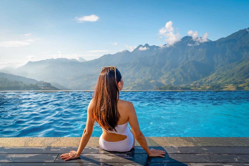 Vietnam luxury package holidays tours featuring a high-end resort infinity pool with mountain views, showcasing premium and exclusive travel in Vietnam