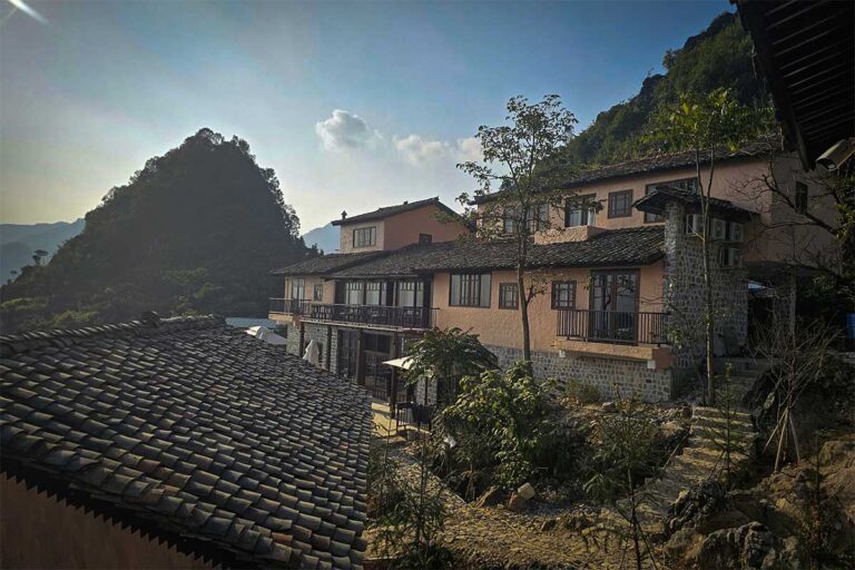 Ha Giang Aya Lodge by Local Vietnam nestled in the mountains, offering a quiet village setting along the Ha Giang Loop