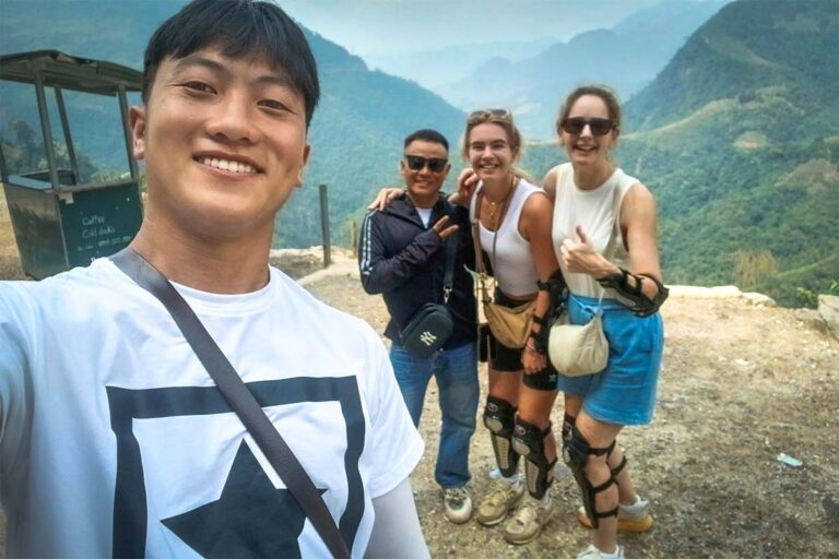 Ha Giang Loop Easy Rider tour with Local Vietnam, showing guests and a local guide at a mountain viewpoint after riding the loop by motorbike