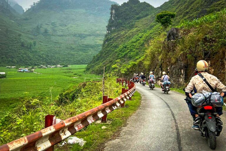 Ha Giang Loop group tour by motorbike with Easy Riders from Local Vietnam, riding through green valleys and limestone mountains on a real guided loop route
