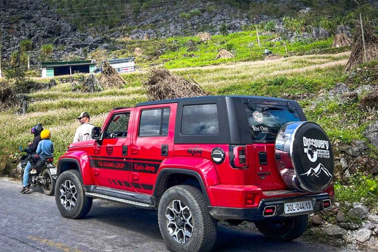 Ha Giang Loop by jeep experience with a modern 4x4 vehicle on scenic mountain roads in northern Vietnam