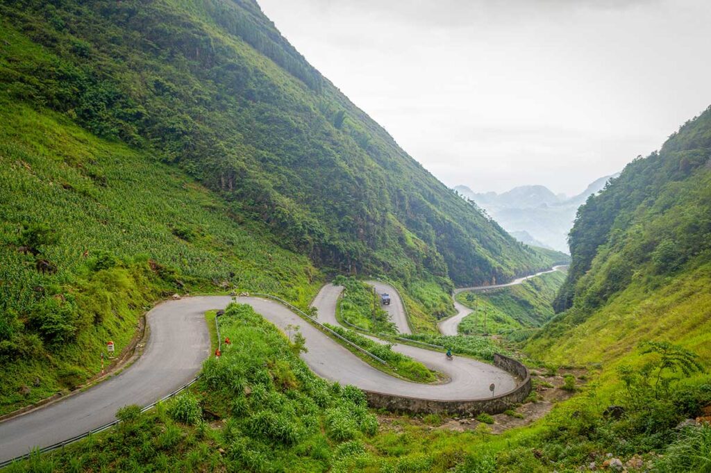Vietnam adventure holidays in Ha Giang featuring panoramic mountain views and river valleys, highlighting one of the most scenic adventure travel regions in Vietnam
