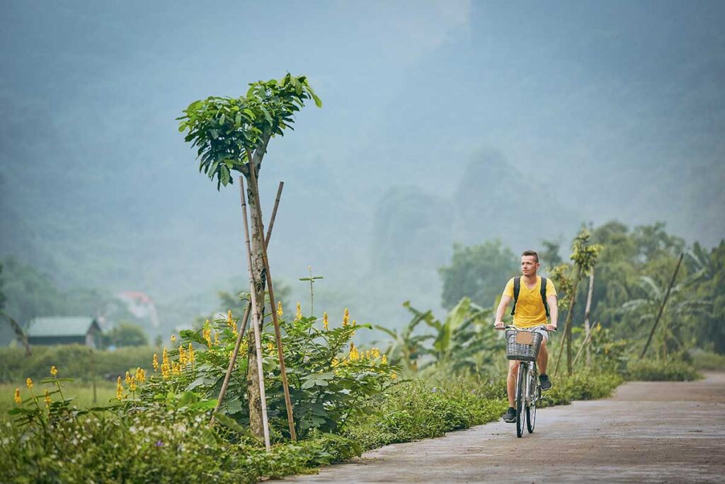 Vietnam slow travel holidays featuring gentle bike rides through quiet countryside, highlighting relaxed and immersive travel experiences in Vietnam