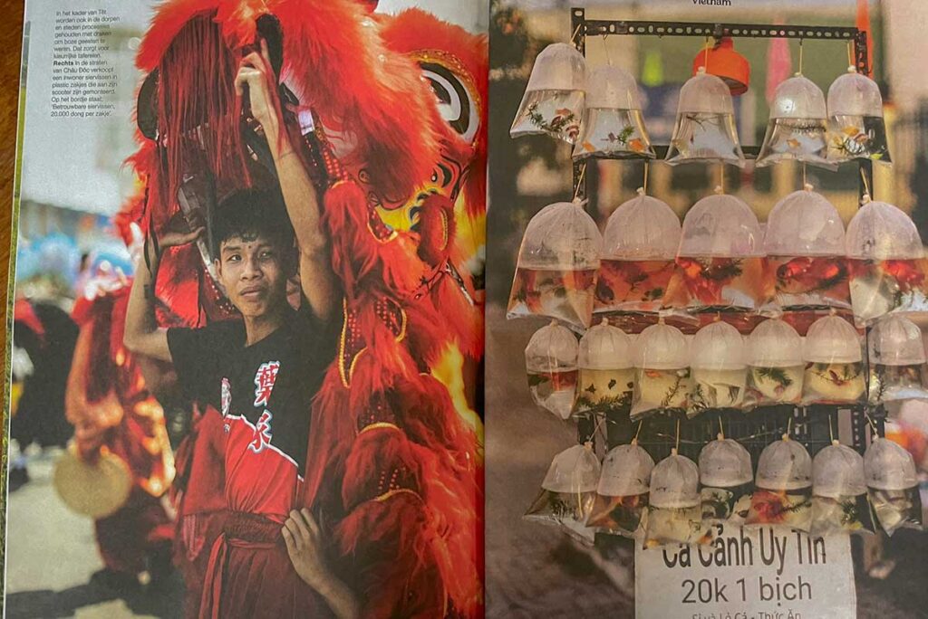 Columbus Travel magazine pages featuring local life in An Giang, including festival scenes and fish market displays in the Mekong Delta