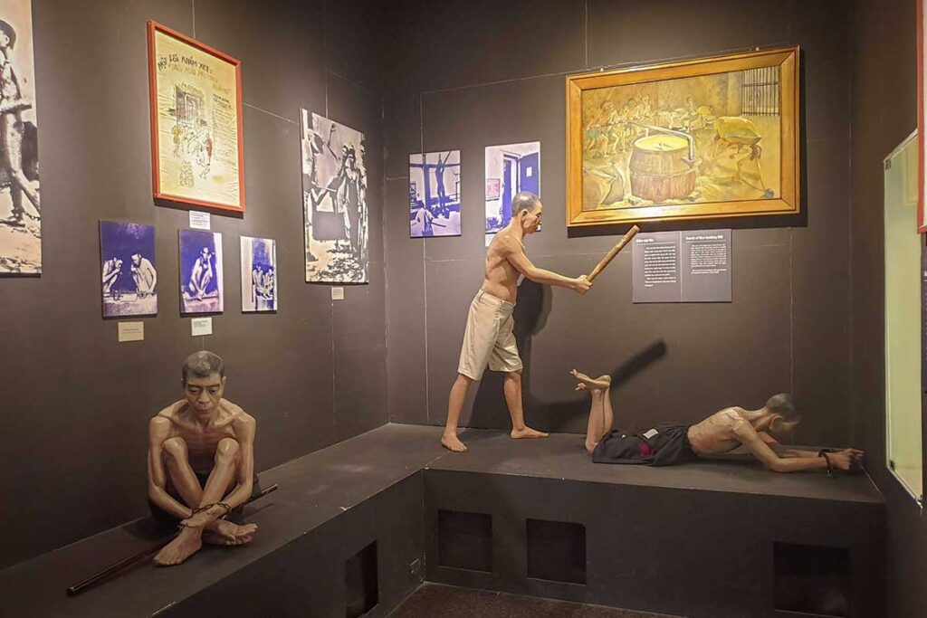 Reconstructed scene in Con Dao Museum showing prisoners being tortured, with mannequins illustrating harsh conditions inside the prison camps.
