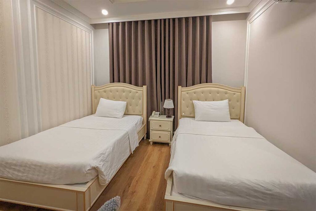 Simple twin room at Maya Hotel 2 Con Dao with basic furnishings and clean layout