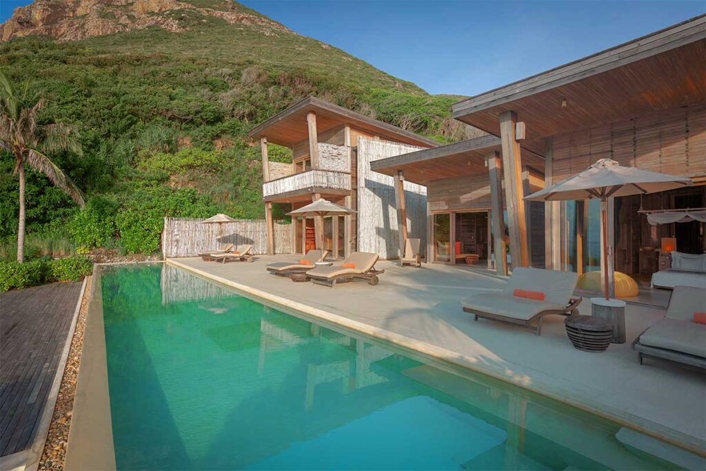 Modern villa terrace with private pool at Six Senses Con Dao surrounded by nature and hillside views