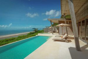 Luxury beachfront villa with private infinity pool at Six Senses Con Dao overlooking the ocean and sandy beach