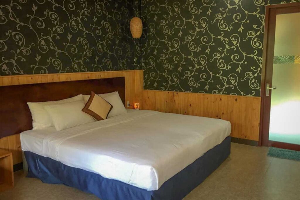 Basic hotel room at Tan Son Nhat Con Dao Resort with simple furnishings and clean layout