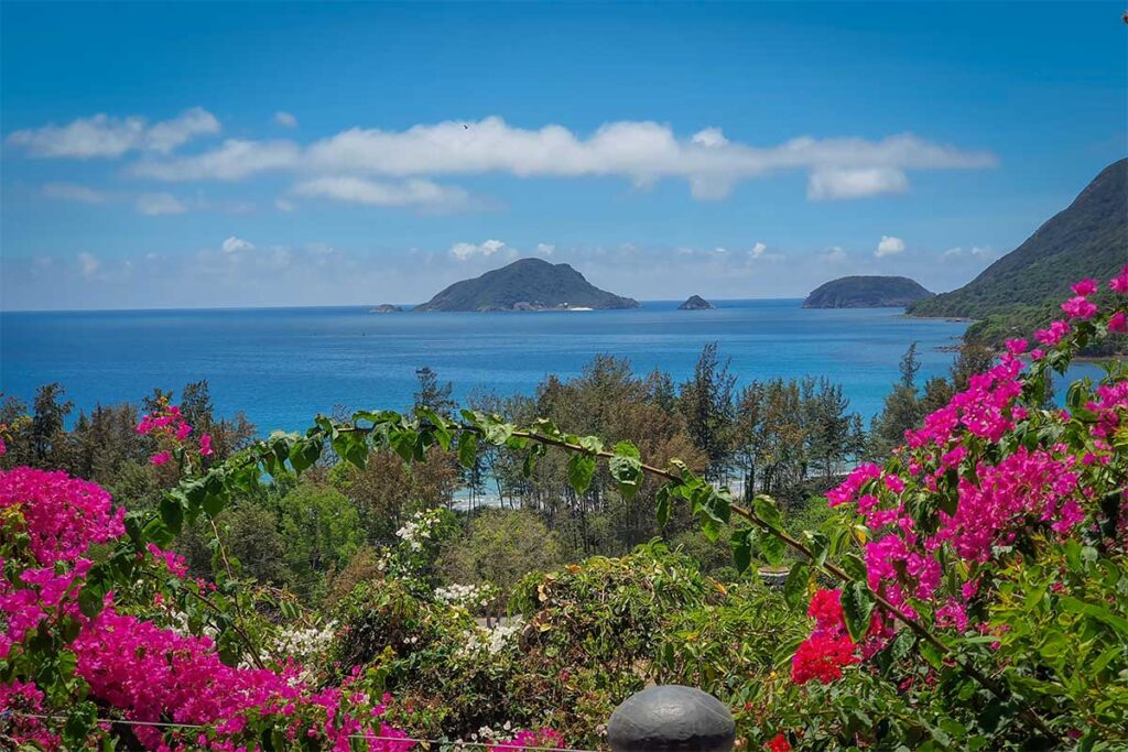 Coastal view from Van Son Pagoda in Con Dao with turquoise sea, small islands and tropical vegetation