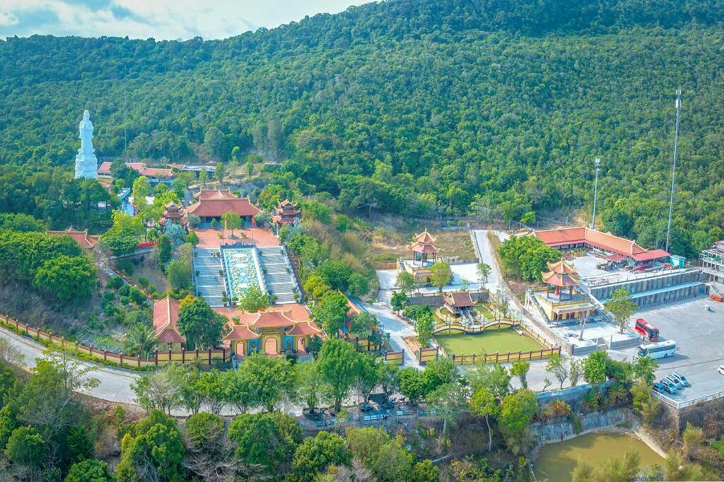 Aerial view of Ho Quoc Pagoda surrounded by forest hills in Phu Quoc Vietnam