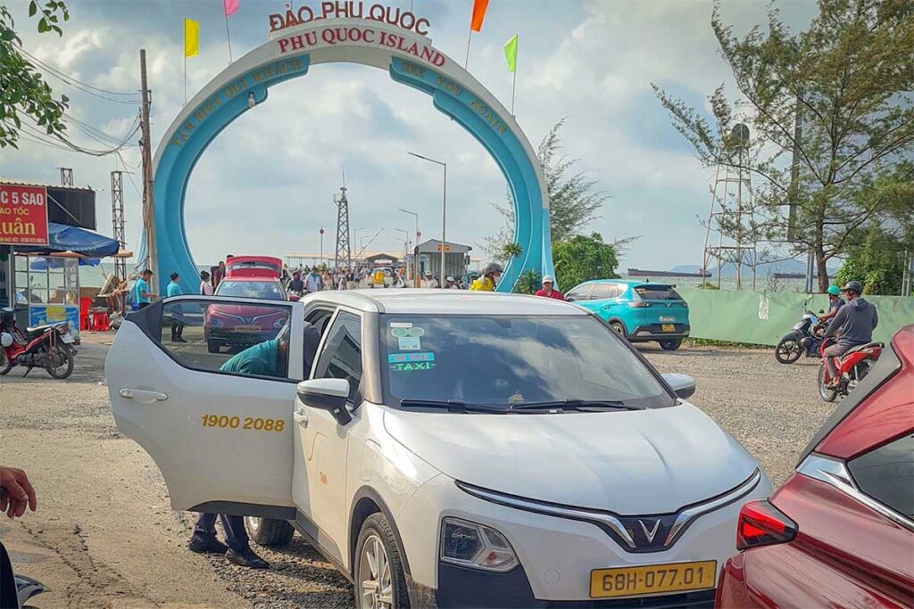 Taxi waiting outside Bai Vong Port entrance in Phu Quoc for ferry passengers arriving on the island