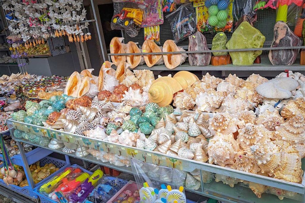 Shell souvenir shop in Ham Ninh fishing village Phu Quoc with large seashells beach toys and local gifts