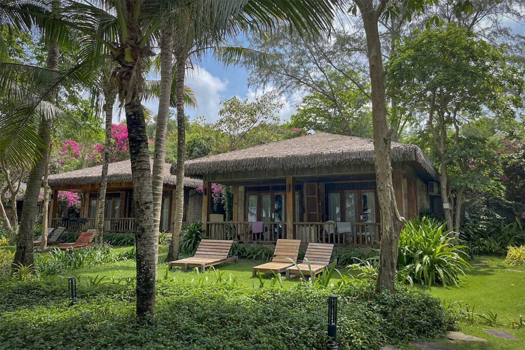 Garden bungalow resort surrounded by tropical trees at Ong Lang Beach Phu Quoc