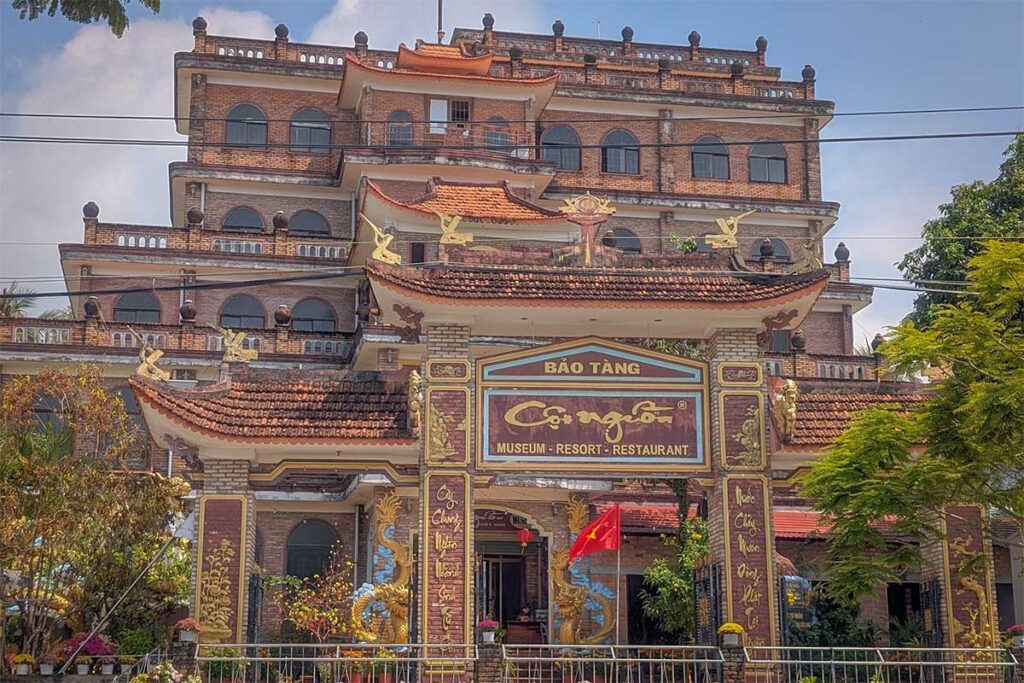 Main gate of Coi Nguon Museum Phu Quoc with temple style entrance and large museum building behind it