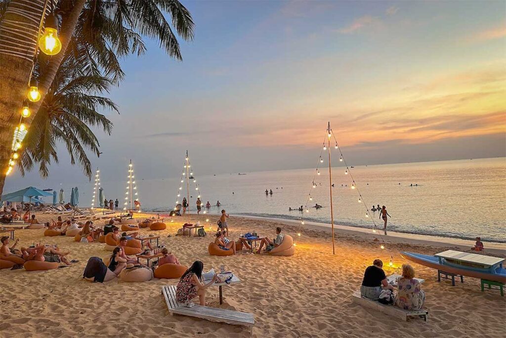 Beach bar on Long Beach near Duong Dong Phu Quoc with sunset seating on the sand and people relaxing by the sea