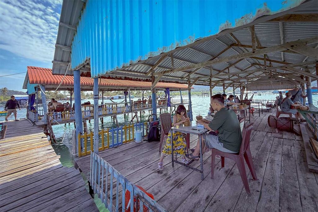 Visitors dining at floating seafood restaurant near Starfish Beach Phu Quoc Rach Vem