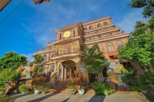 Front entrance of Coi Nguon Museum Phu Quoc with unique multi floor building traditional design and dragon statues