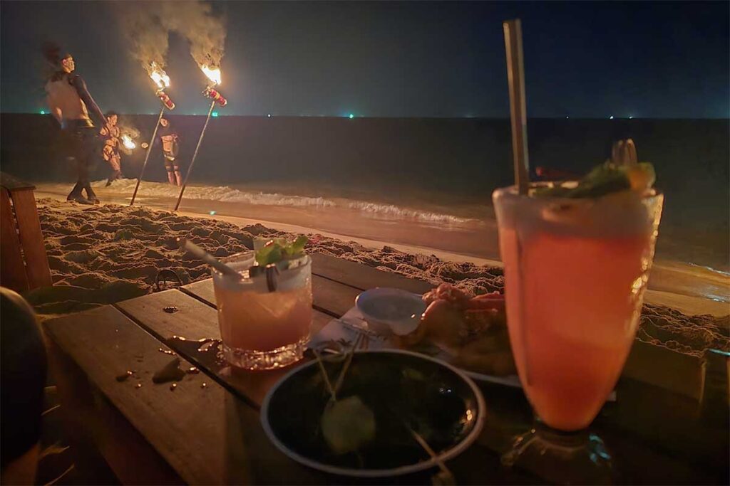 Fire show at Long Beach Phu Quoc beach bar with cocktails and nightlife on the sand