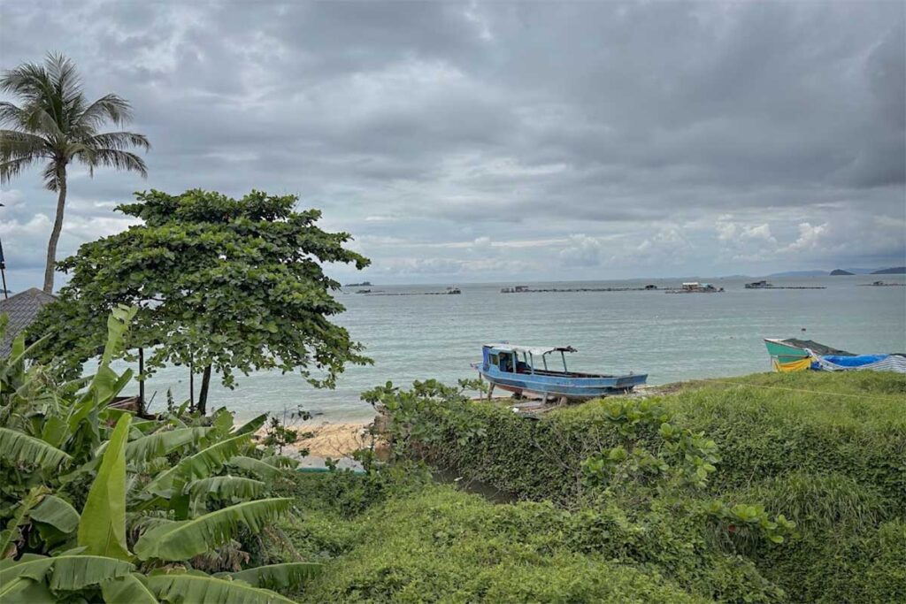 Fishing boat near Ganh Dau Beach Phu Quoc with sea view under cloudy sky