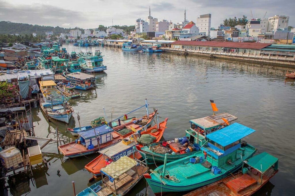 Colorful fishing boats along Duong Dong River in Phu Quoc town near the local market