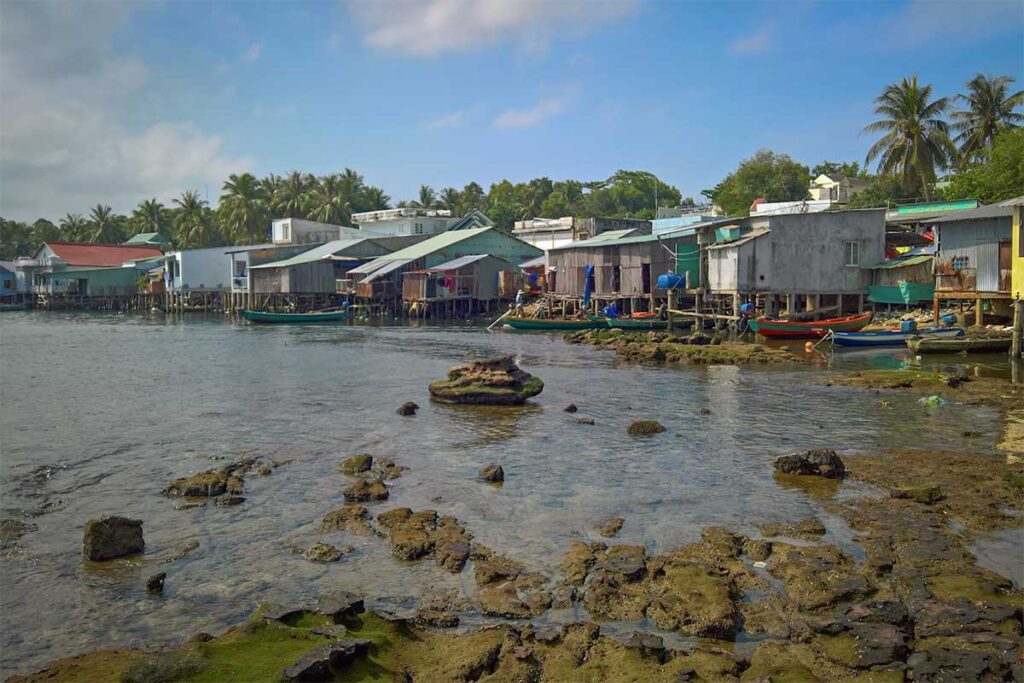 Stilt houses in Ganh Dau fishing village Phu Quoc along a rocky shoreline